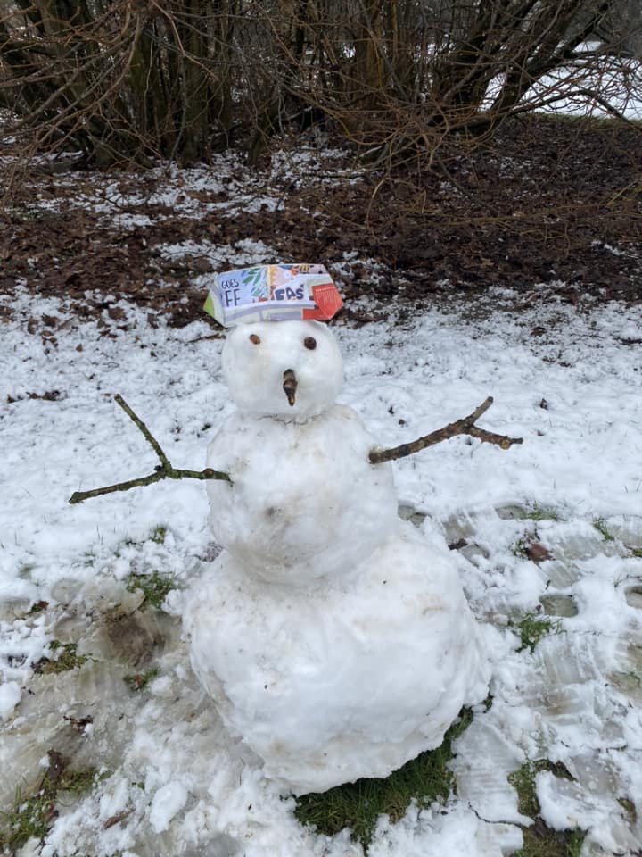 Snowman in March during the heavy snow fall